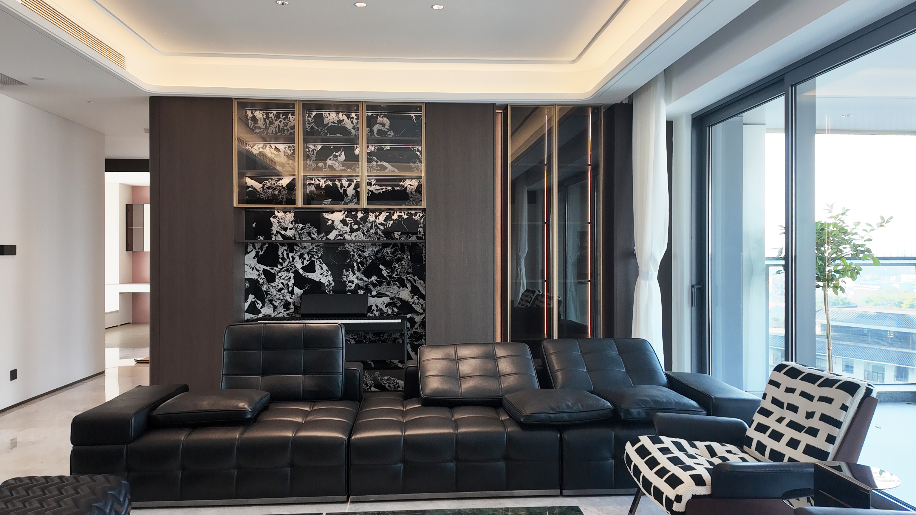 Living room cabinetry and wall panels in a completed Guangzhou residence